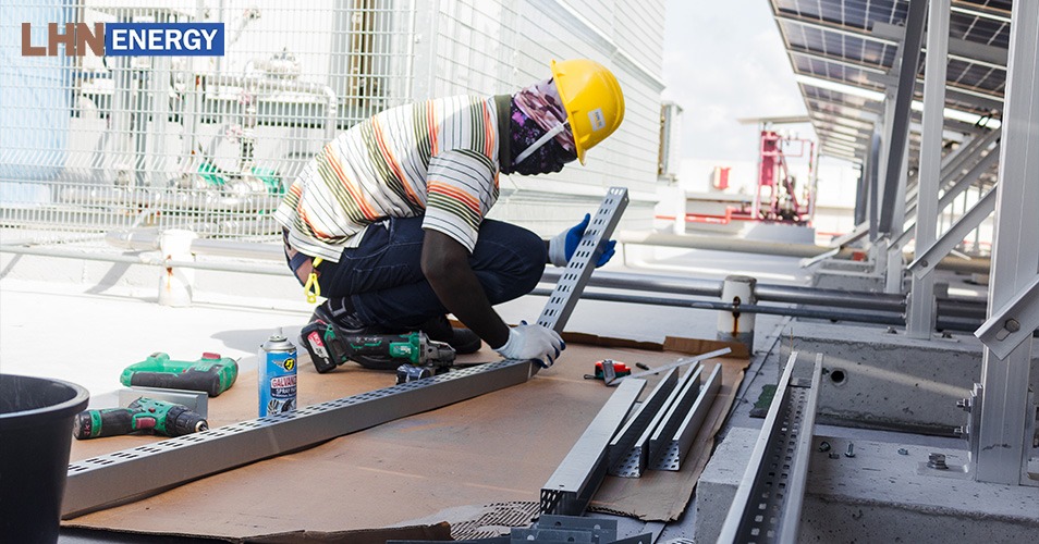 a worker installing solar panels
