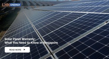 A wide outdoor view of multiple rows of solar panels in a field.