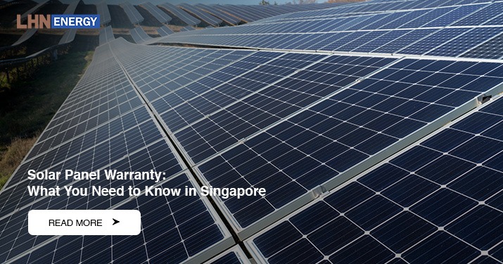 A wide outdoor view of multiple rows of solar panels in a field.