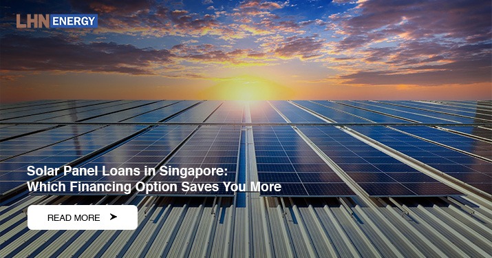 Rows of solar panels installed on a metal rooftop under a vibrant sunset with orange and blue clouds.